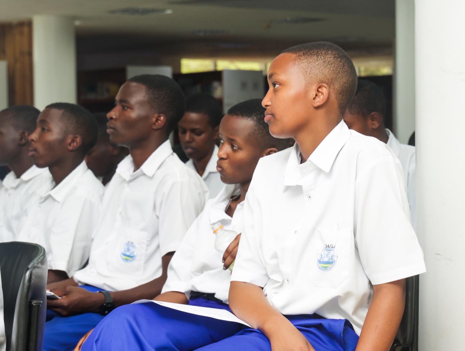Students listening during the opening session